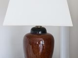 a lamp that is sitting on a table with a lamp on it