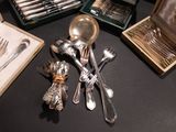 a table with silverware and silverware on it