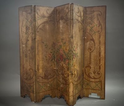 an old wooden screen with floral designs on it on a gray background