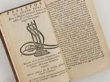 un livre ouvert sur lequel est dessiné un oiseau