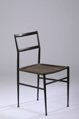 an image of a black chair with a woven seat and back