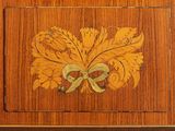 a wooden cabinet with a decorative design on it
