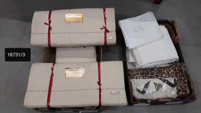 three suitcases that have been wrapped in red ribbon