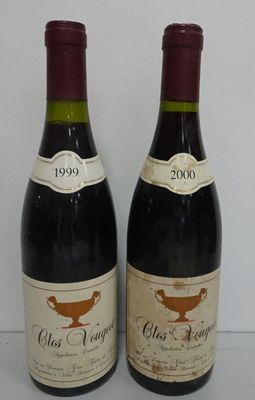two bottles of wine sitting next to each other on a table