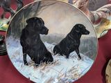 a plate with a picture of two dogs on it