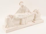 a figurine of a nativity scene on a white background