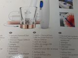 a box of toothbrushes and a glass on the table