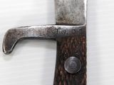 a knife that is on top of a piece of wood