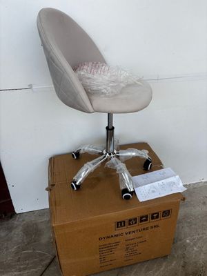 a chair that is sitting on top of a cardboard box