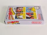 a box of nintendo games sitting on a white surface