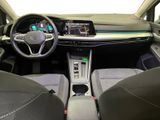 the interior of a car with a steering wheel, dashboard, and dashboard controls
