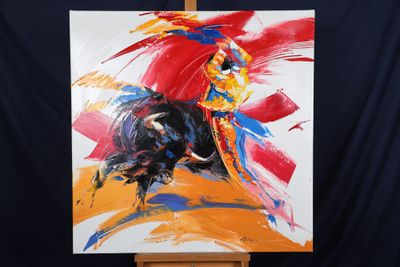 un tableau représentant un taureau sur un chevalet, sur fond noir