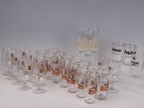 a lot of glasses that are sitting on a table