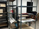 a room with a lot of shelvings and shelves