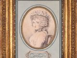 portrait of a woman in a hat and dress, framed in a gold frame
