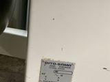 a close up of a machine with a button on it