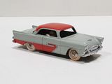 a toy car that is sitting on a white surface
