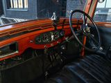 a dashboard and steering wheel of an old car