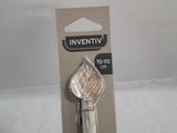 a silver object in the packaging on a white surface