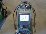 a machine that is sitting on the floor in the garage