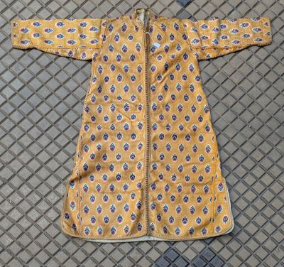 a yellow jacket with a blue and white pattern on it