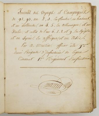 an old book with writing on it sitting on top of a table
