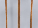 an image of a wooden easer with a wooden handle on a white background