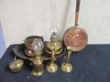 a lot of antique brass items on the table