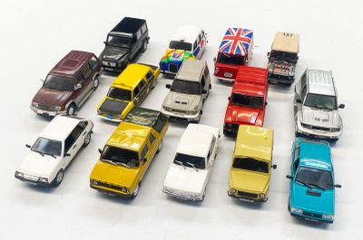a lot of toy cars that are on a white surface