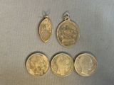 a close up of a group of coins on a table