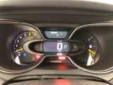 the dashboard of a car with a digital clock on it ' s display
