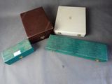 three boxes are sitting on a table next to each other