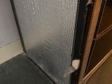 an image of a metal door with a hole in it