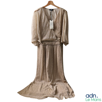 a dress hanging on a hanger on a white background