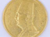 l'image d'une pièce d'or sur laquelle figure le visage d'un homme