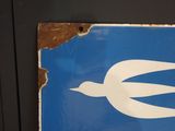 a blue and white sign with a bird on it
