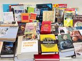 a lot of books that are sitting on a table