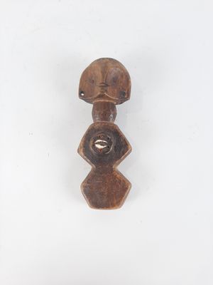 a close up of a wooden object on a white surface