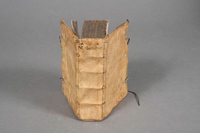 an old book that is sitting on a table