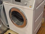 a washer and dryer sitting on a pallet in a store
