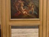 une image d'un tableau sur le mur d'une pièce