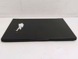 a laptop that is sitting on a white table