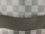 an image of a close up of a checkered bag