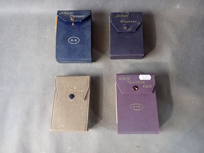 three boxes of cigarettes sitting on top of a table next to each other