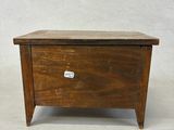 pair of wooden nightstands with drawers on each side of them