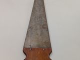 an old hand saw with a wooden handle on a white background