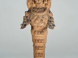 an image of a statue of a man with a bird on his head