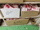 many boxes of money sitting on a shelf in a room