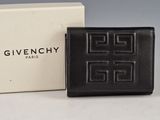 a givenchy black leather wallet with a white box