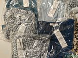 a pile of clothing that is wrapped in plastic